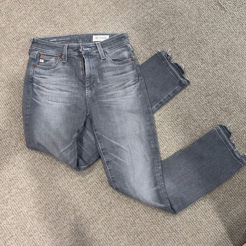 Never worn Agolde denim jeans. Size 25. Grayish color.